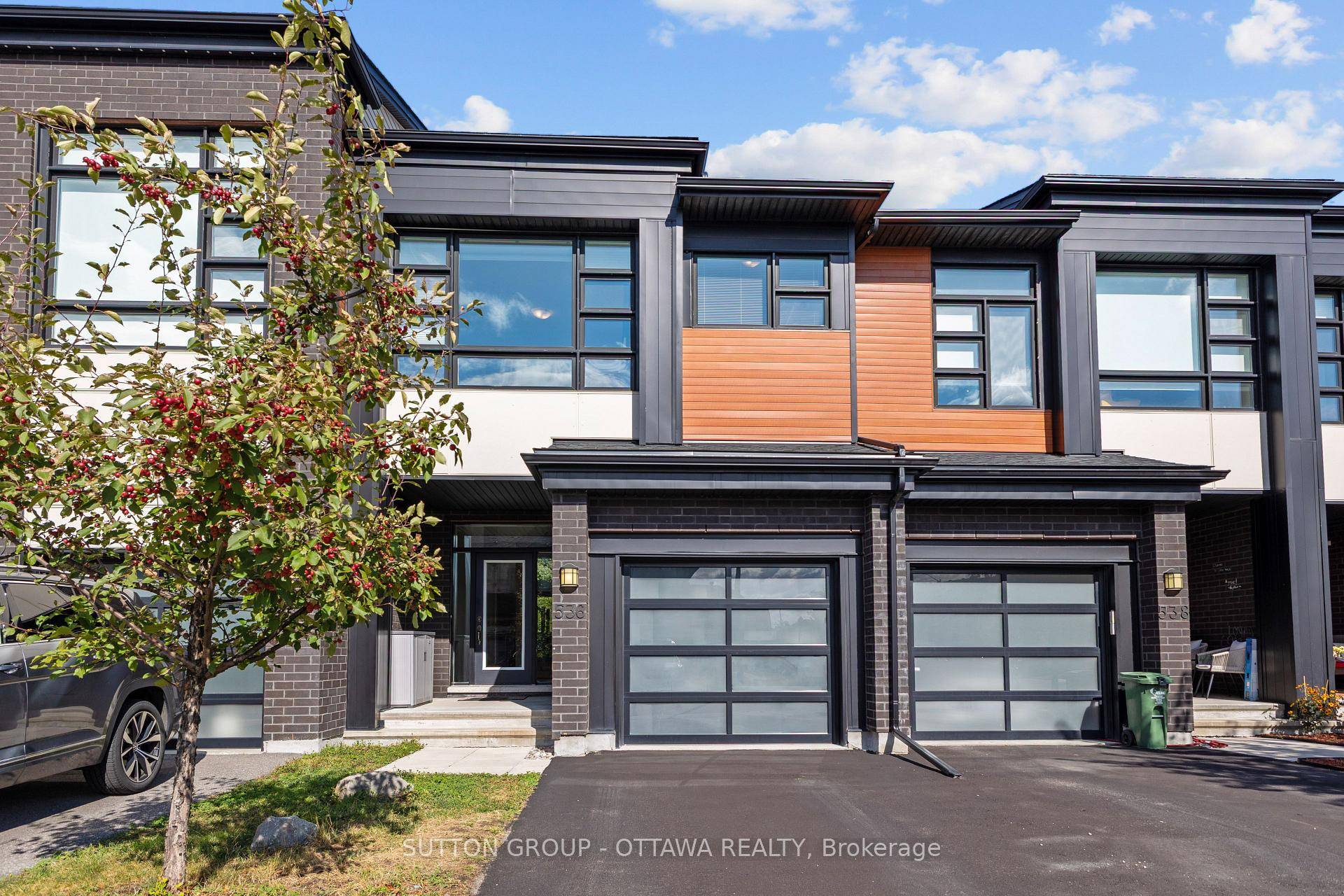 Stunning 2019 built 2 bedroom plus loft townhome potential to convert loft to a 3rd bedroom, nestled in a quiet, family friendly enclave and backing onto a serene treed greenspace ...