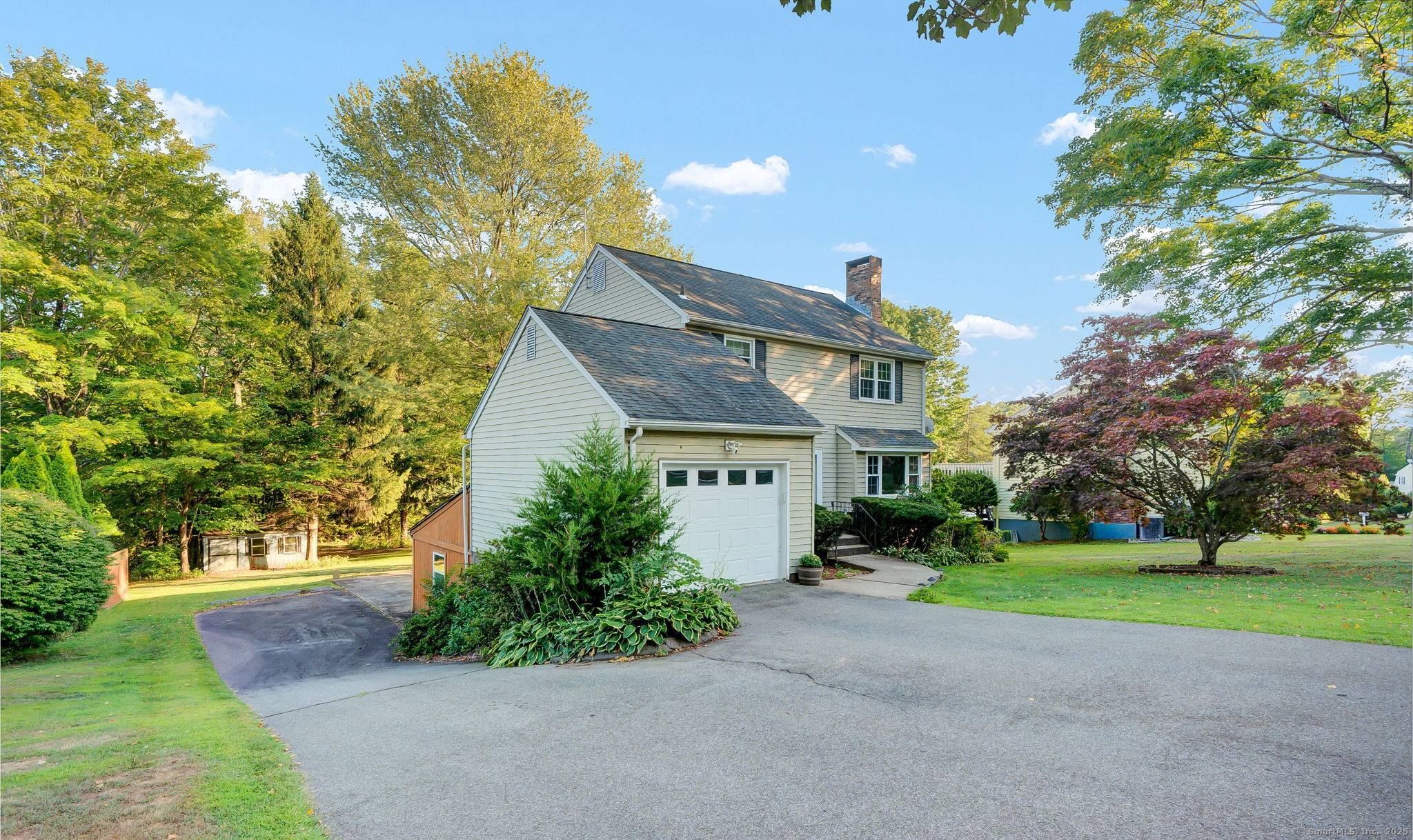 Opportunity awaits in this colonial style home with walkout lower level !