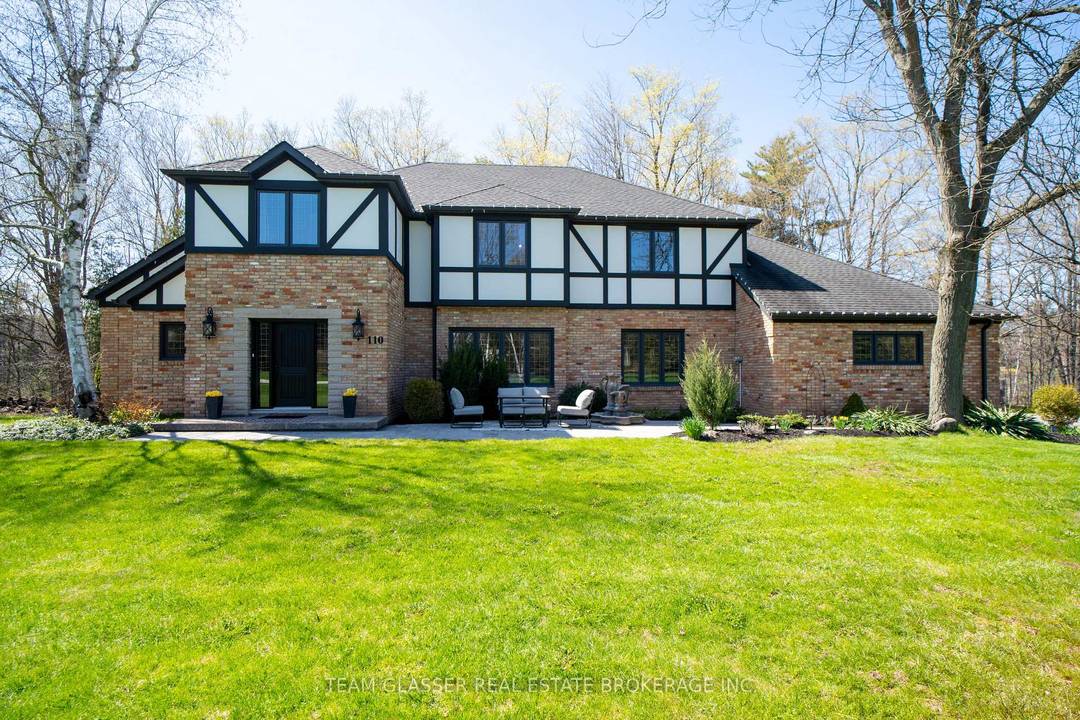 Distinguished Tudor style estate set on 2 acres in one of Halton's most sought after executive enclaves, Campbellville Estates, backing onto a sweeping forest for a rare sense of seclusion ...