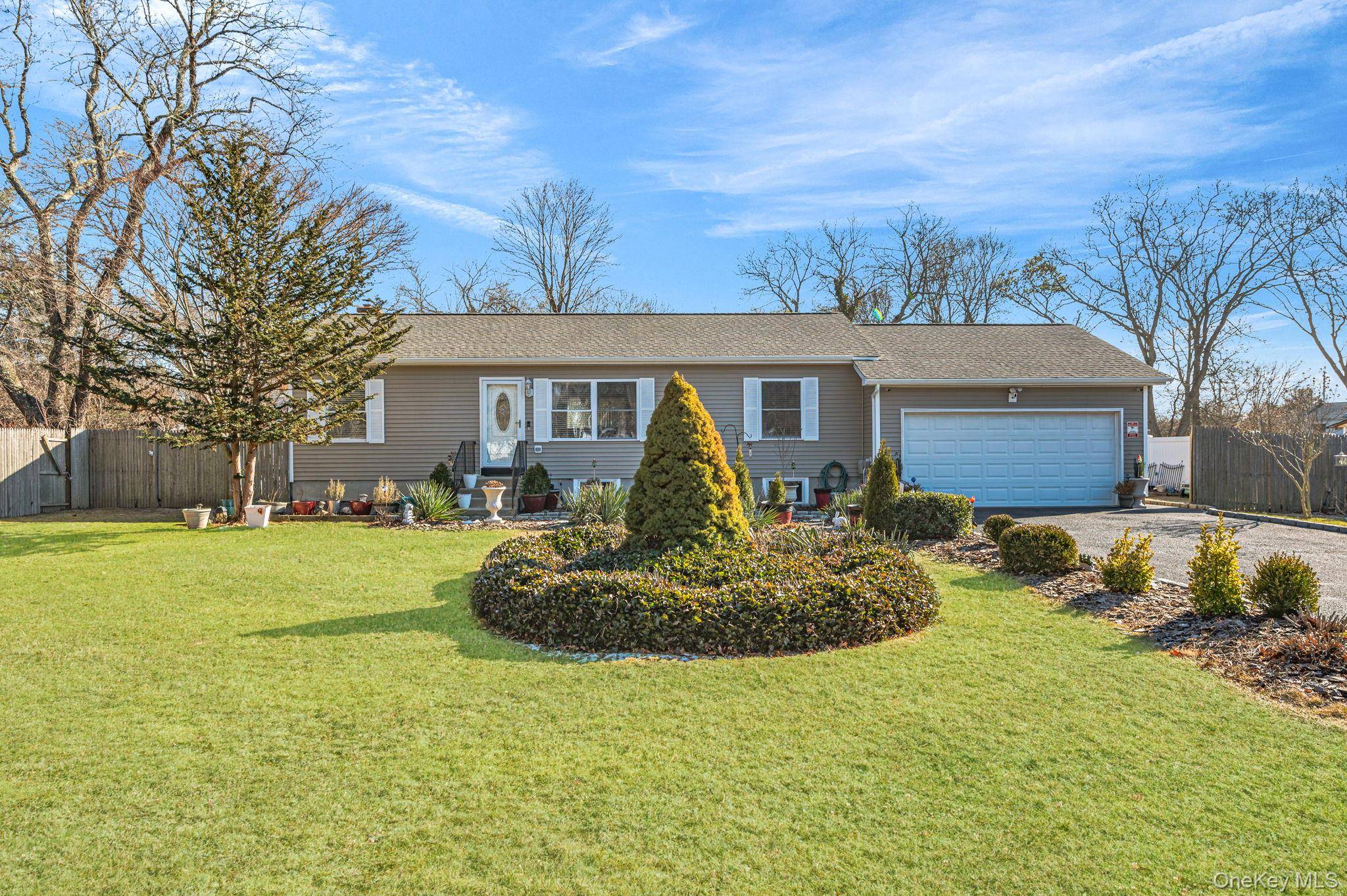 Immaculate 2004 built home with a new roof 2024 on a spacious half acre private lot !