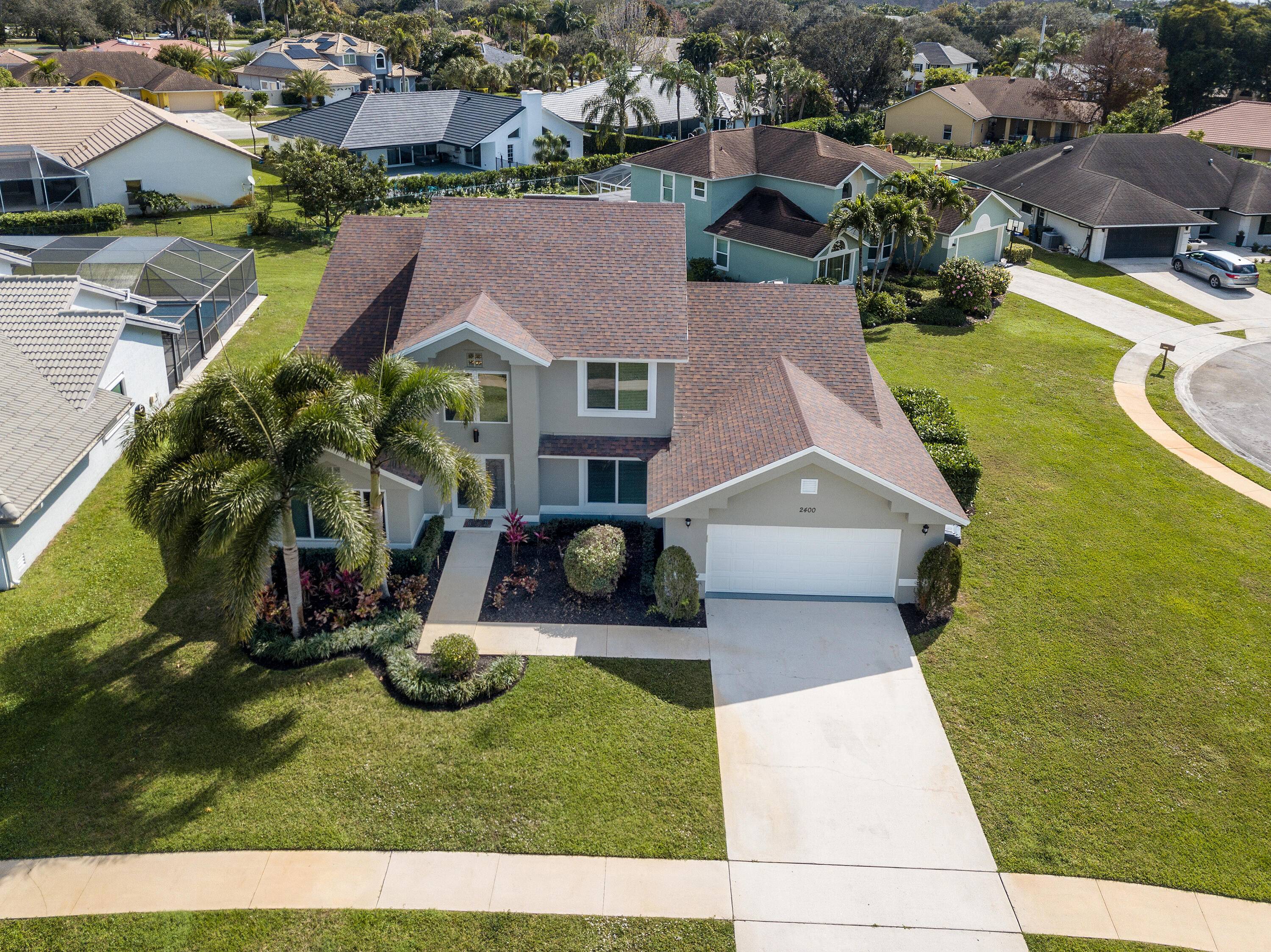 Massive 4 bedroom, 3. 5 bathroom CBS pool home in the desirable Greenshores of Wellington community.