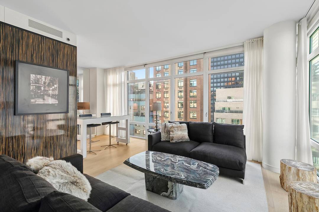 Luxury Living in the Heart of Midtown Welcome to Residence 19B at Place 57, a beautifully designed 2 bedroom, 2.