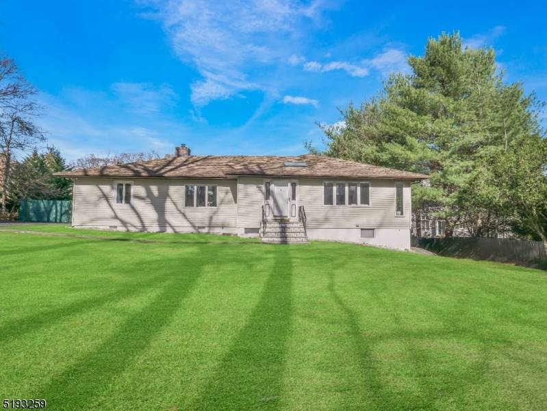 Beautifully renovated custom Ranch in a rare, dual access location fronting Ratzer Road and extending to quiet, dead end Bourbon Street.
