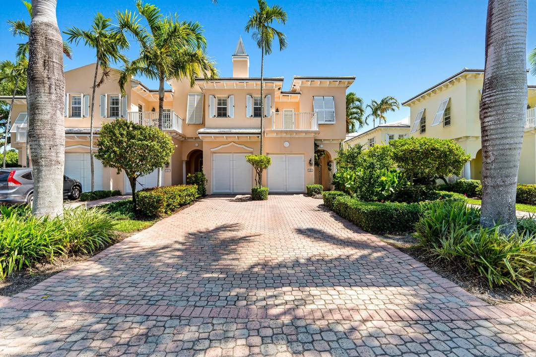 Delray Beach courtyard townhome in the sought after enclave of The Landings is located close to the community pool and two blocks to the beach.