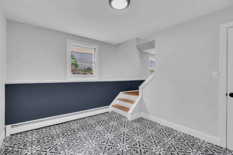 Beautifully updated 4 bedroom, 2 full bath raised ranch located in desirable Shore Hills !