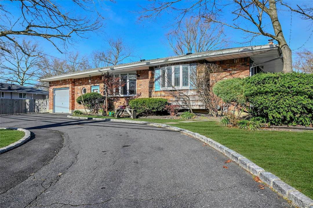 Nestled in the heart of Melville, this expanded ranch combines convenience, a versatile floor plan, and incredible potential.