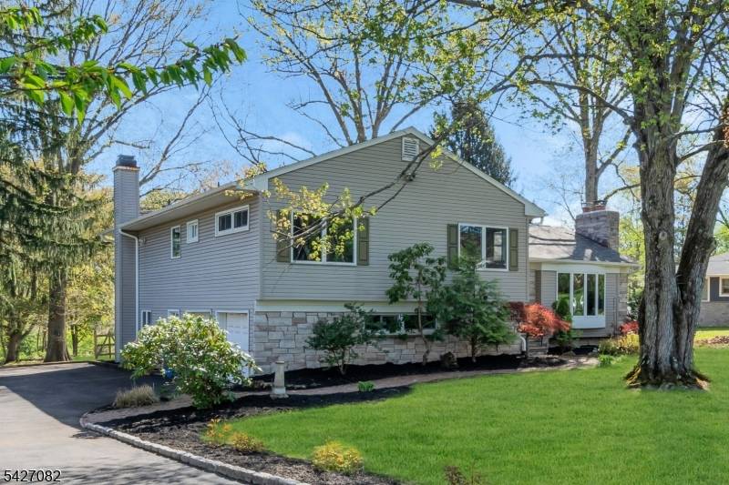 Spacious 4 bedroom, 3 full bath split level home situated on a generously sized lot in a peaceful setting.