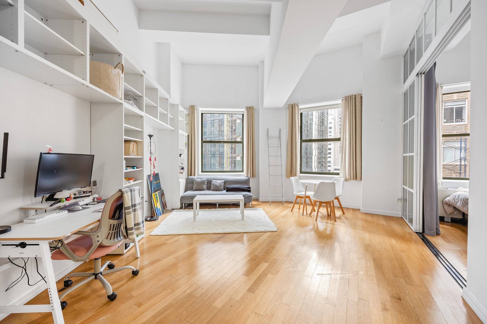 Discover a chic, expansive studio apartment in the celebrated 99 John Deco Lofts at Apt 1213.
