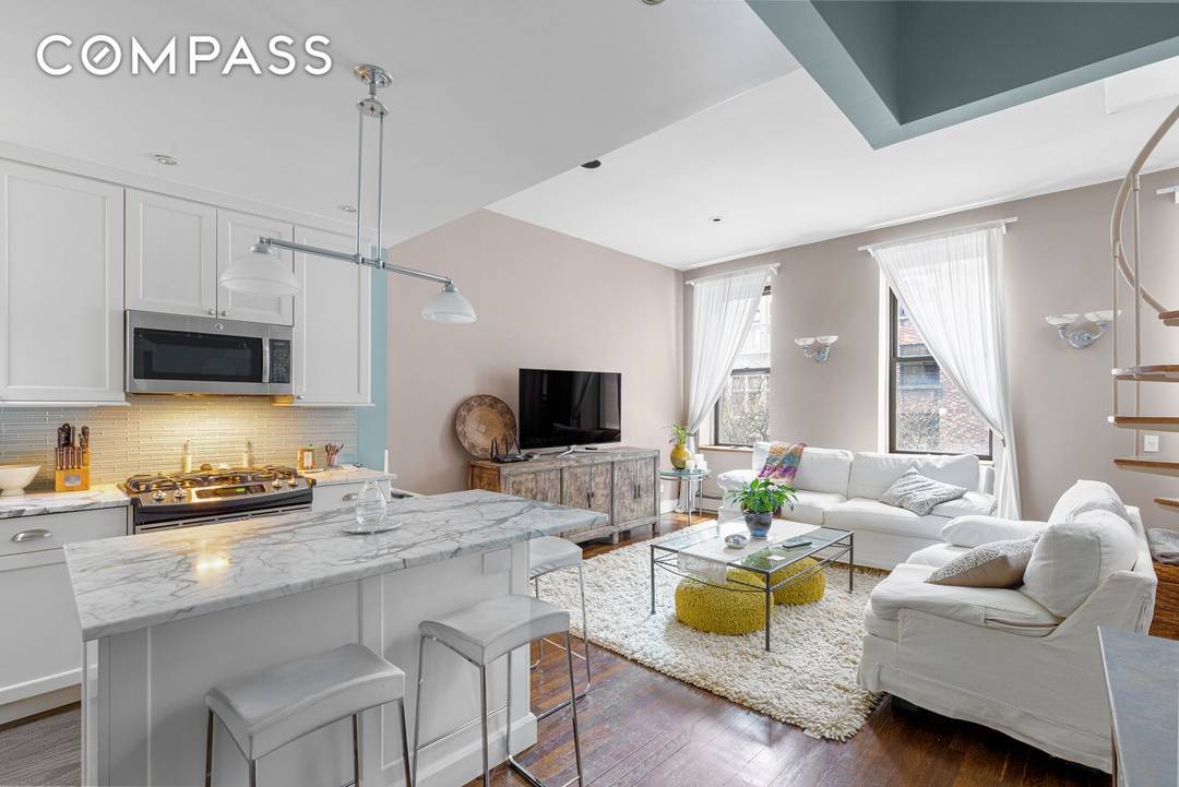 Elevate your lifestyle ! Stunning, top floor duplex home with private roof deck and terrace !