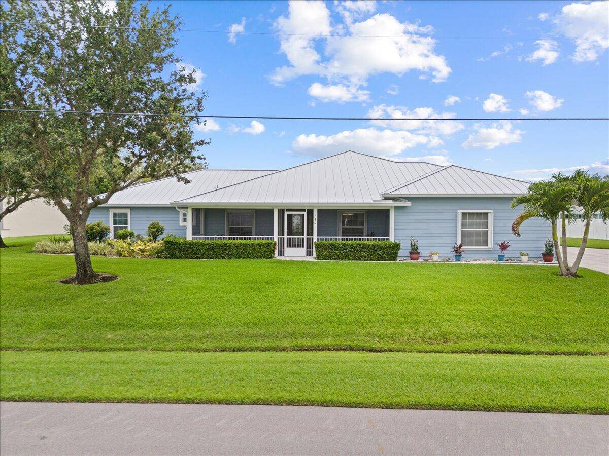 Exceptional Home on double lot with canal setting offers stunning well maintained home in PSL.