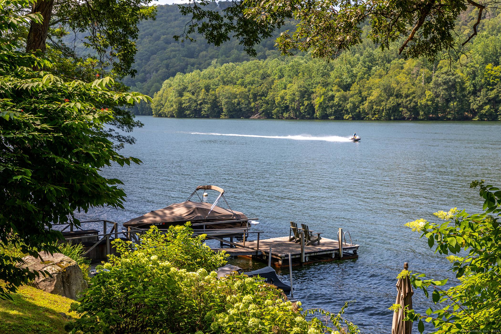Quintessential Candlewood Lake Stone Cedar expanded cottage exudes authenticity with modern day amenities and a plethora of quality updates !