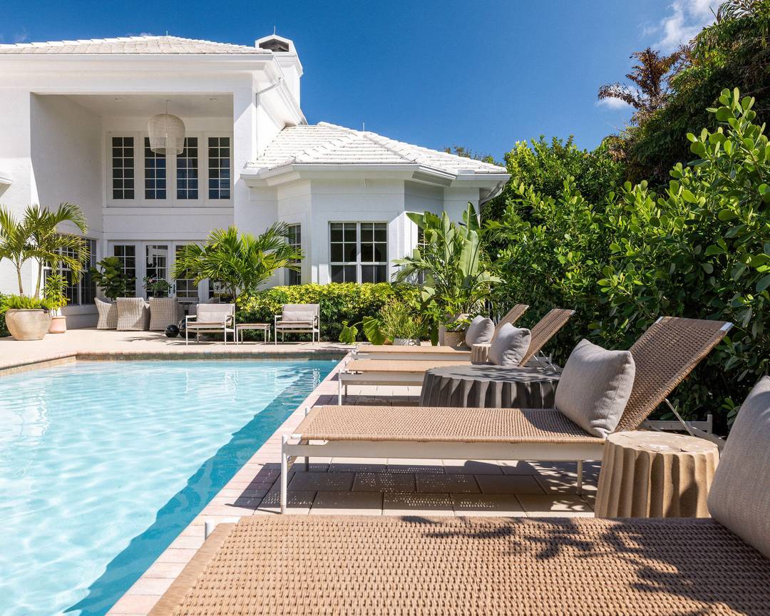 Meticulously modernized over three years by artist owners as their primary family home, this elegant Mediterranean estate conveys luxurious Palm Beach living with an effortless Southern California aesthetic.