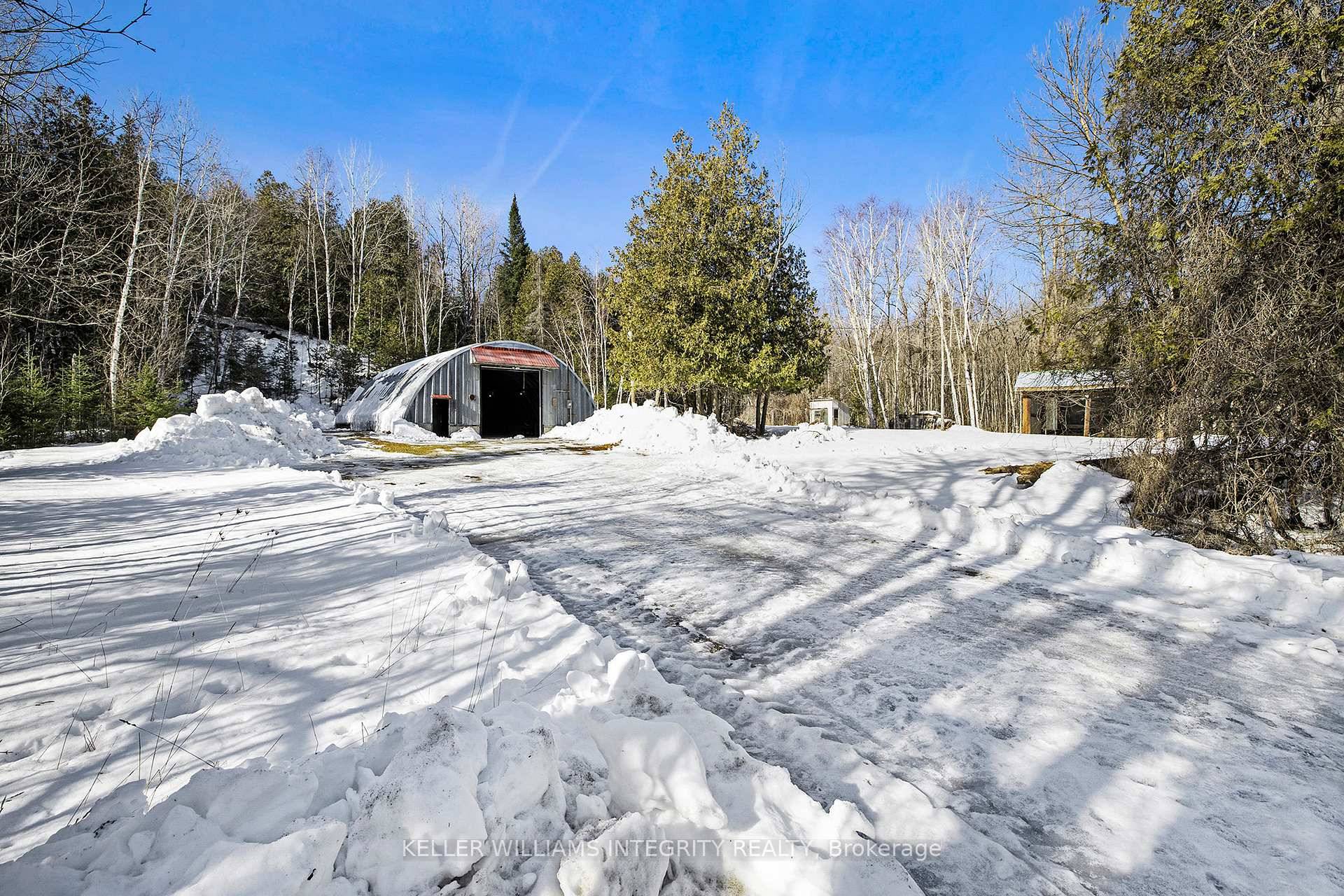 Discover an incredible opportunity with this impressive 2000 square foot steel Quonset hut, beautifully set on a generous 1.