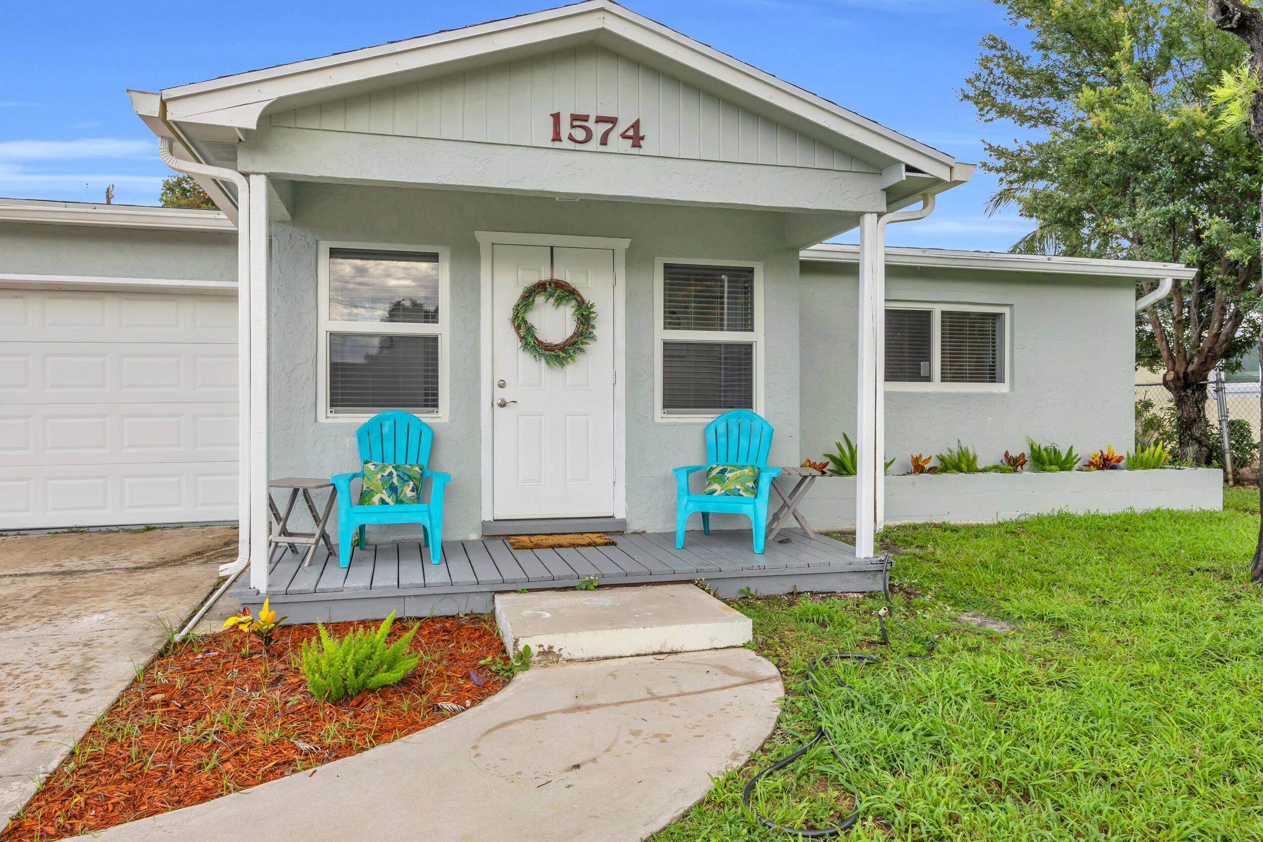 Welcome to this stunning, fully remodeled home nestled in a quiet neighborhood of desirable Jensen Beach.
