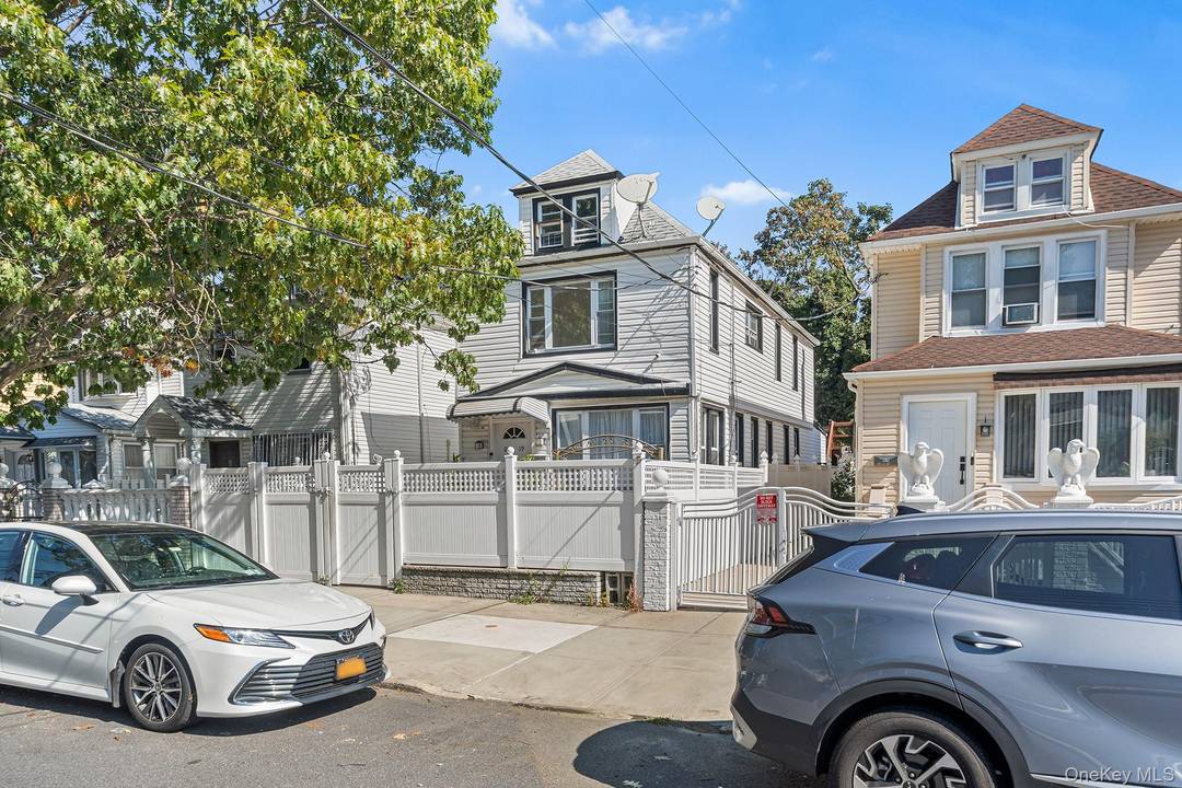 Welcome to this charming two family detached home in the heart of South Ozone Park !