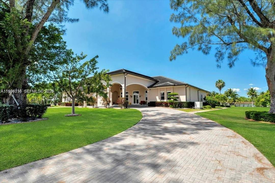 Resort style living in the heart of Miramar, located within the prestigious Country Club Ranches community with no HOA.