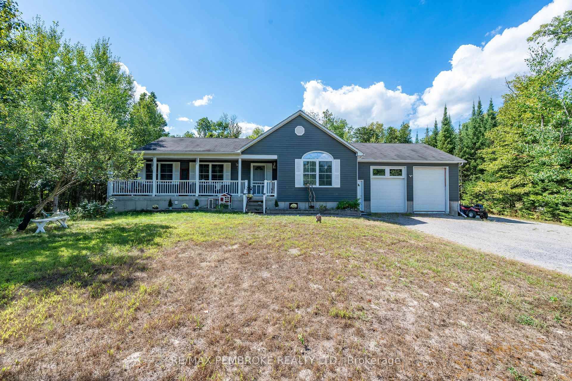 Custom Built Bungalow on nearly an acre lot !