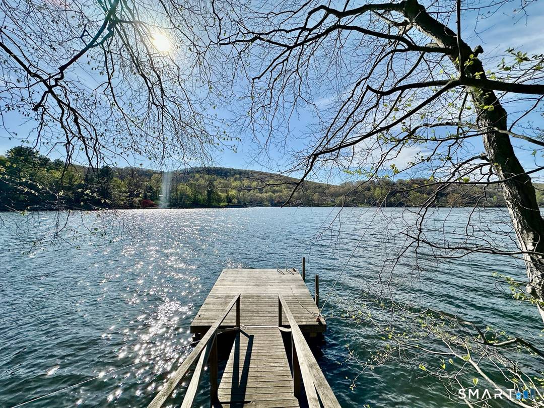 Nestled along the shores of Candlewood Lake, this masterpiece of mid century modern design, blends timeless elegance with waterfront living.