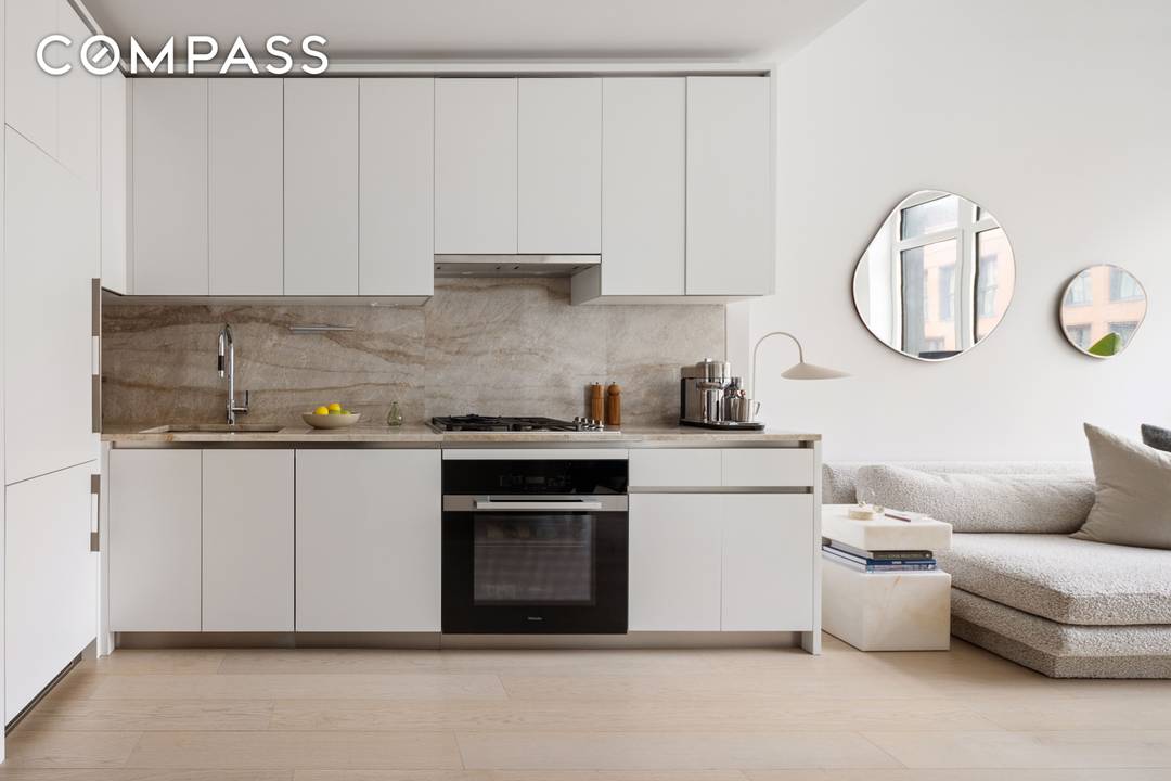 Residence 617 at 450 Washington Street is a sun filled one bedroom home featuring customized California Closet build outs in both primary bedroom closets, automatic blinds, and blackout shades in ...