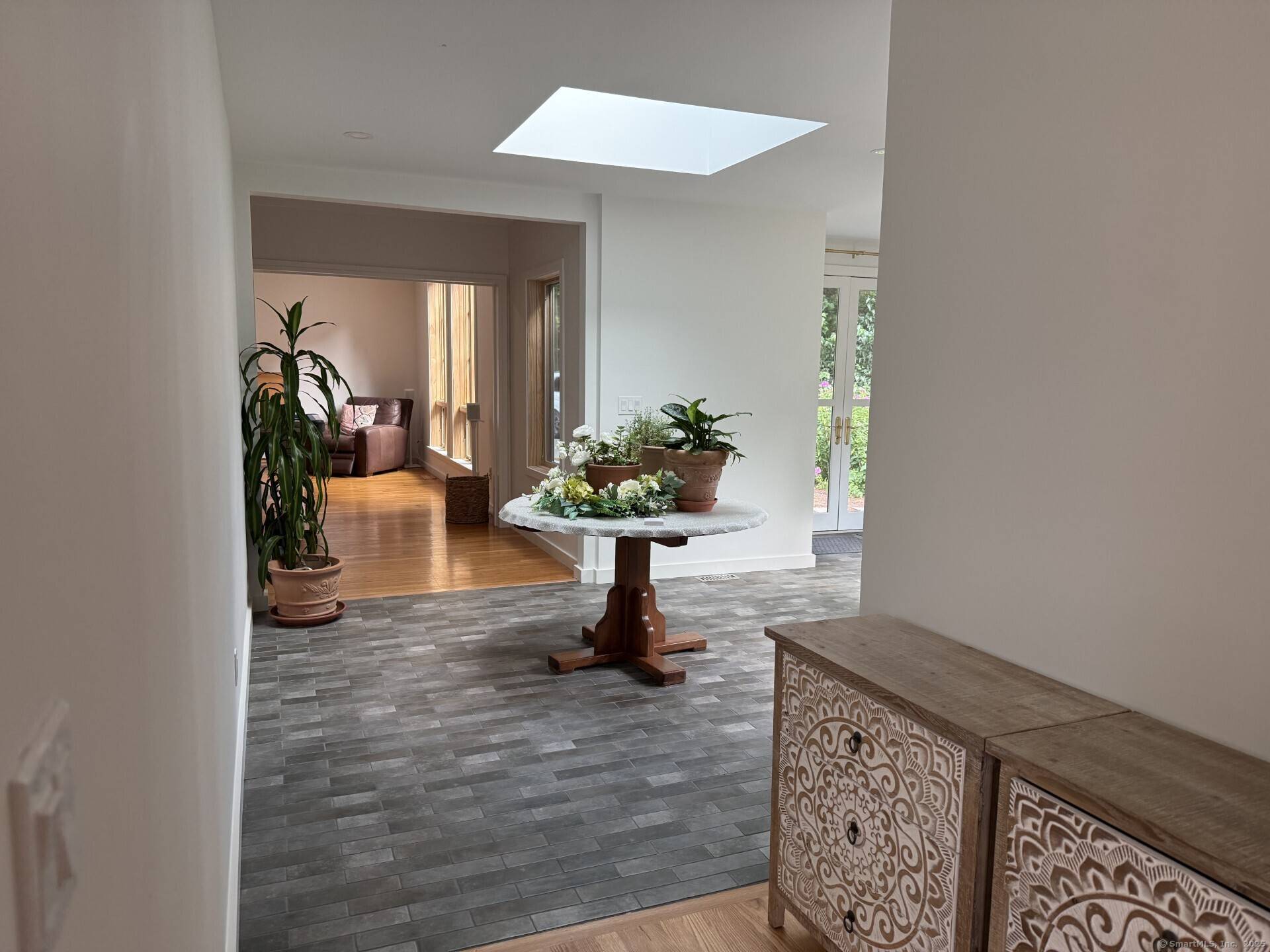 Nestled in the charming New England town of Madison, CT, this contemporary ranch home offers a spacious comfortable summer retreat.