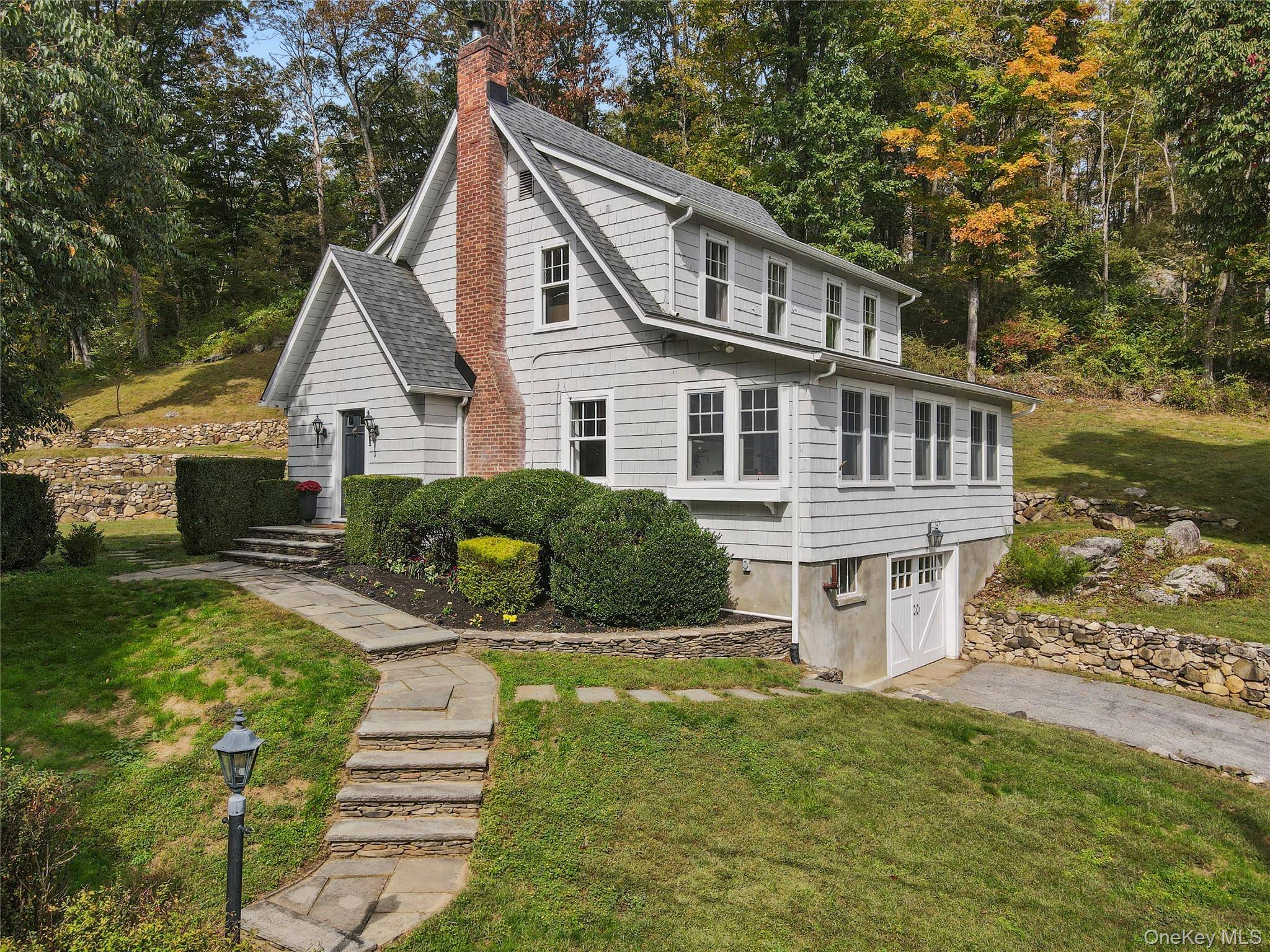Step into timeless charm this lovingly renovated antique sits on a peaceful road within walking distance to the Purdys train station.