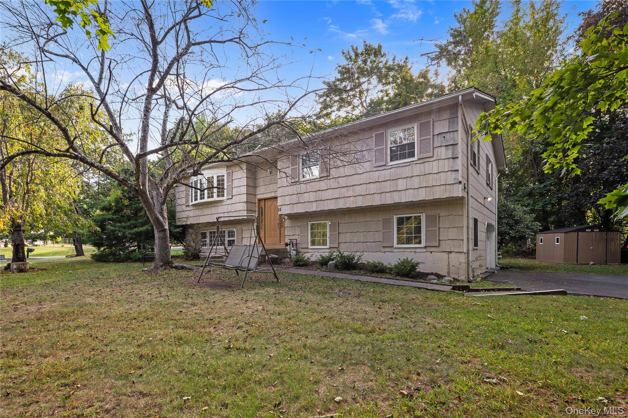 Look no further ! Unique opportunity to own a move in ready high ranch on this desirable cul de sac in New Hempstead !