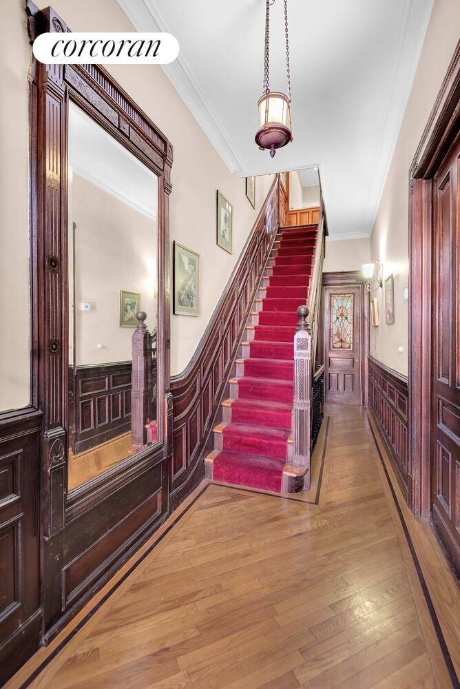 Step into timeless elegance with this majestic two family brownstone, a true testament to the golden age of craftsmanship.