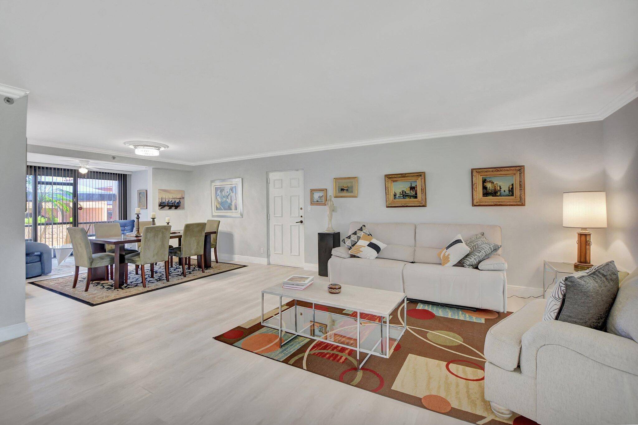 This stunning first floor condo offers a spacious and modern living space with three bedrooms and 2 1 2 bathrooms.