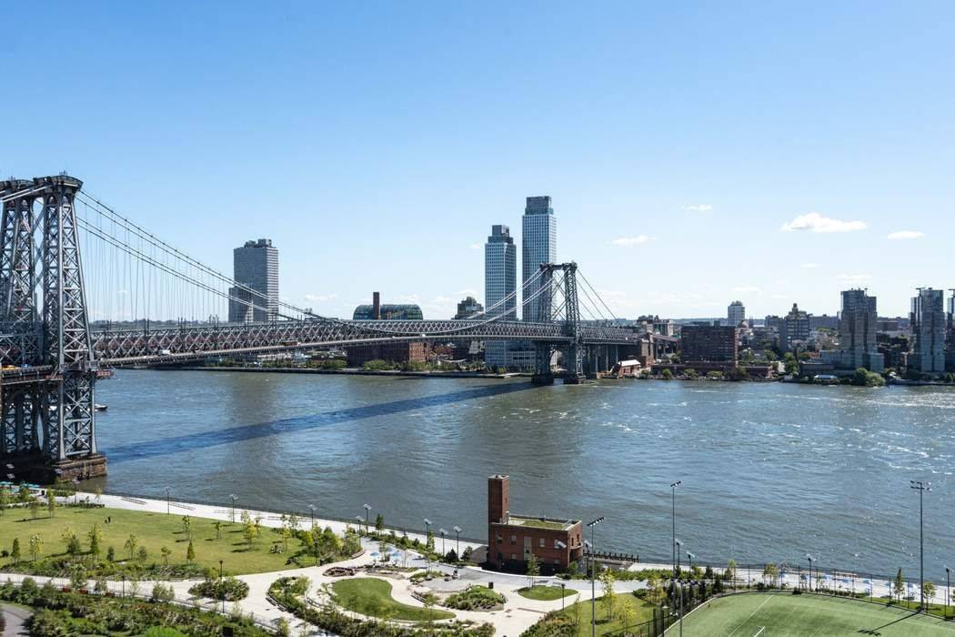 Located on a high floor, this bright and airy two bedroom apartment boasts sweeping views of the NYC skyline, East River, and iconic bridges.