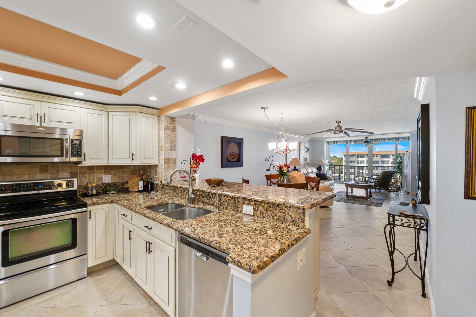 This 2 bedroom 2 bathroom stunning penthouse 55 condo offers serene waterfront views of the marina and pool, providing a daily escape to paradise.