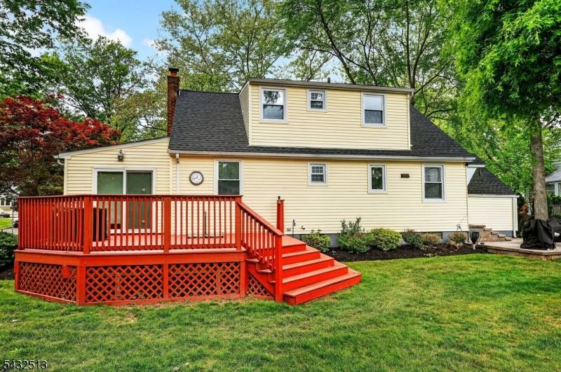 Charming and updated expanded cape on landscaped setting.