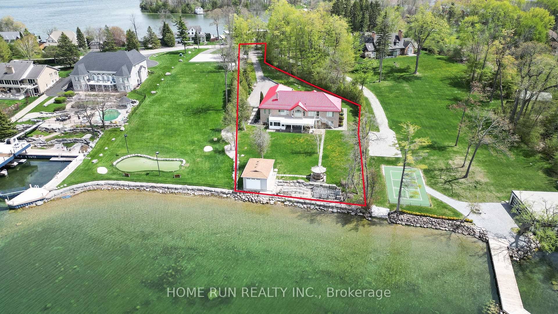 WATERFRONT ! This sensational waterfront property offers the ultimate in resort living in One of the Orillia's Most Prestigious Communities !