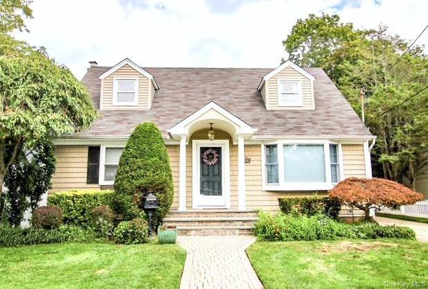 Welcome to this fabulous expanded Cape with rear dormer, perfectly set on an oversized 55x150 property.