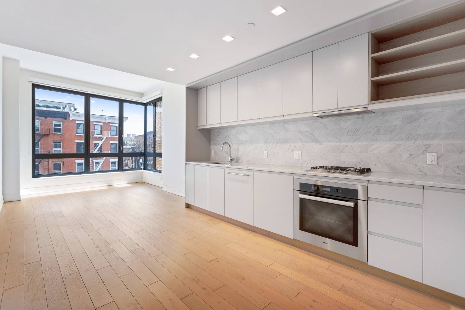 323 is a stunning, east facing one bedroom, one bath, with in unit washer dryer, wide plank wooden flooring throughout, and open city views all in Prospect Heights premier luxury ...