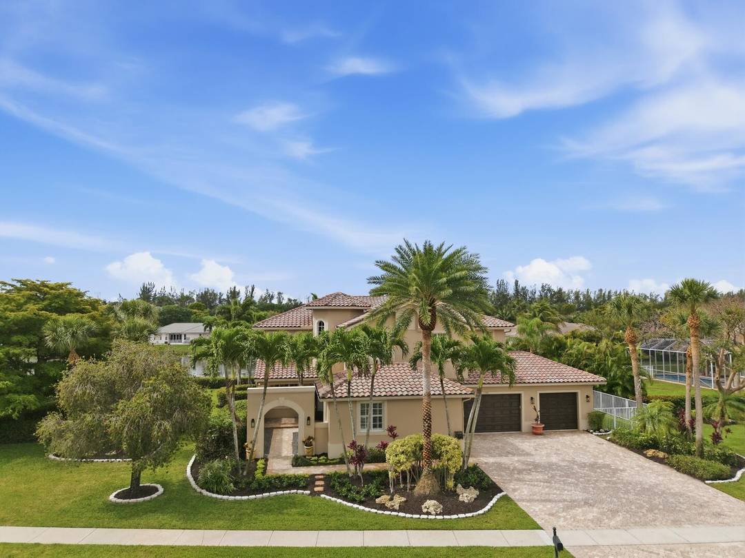 Set on a beautiful lakefront lot in the highly sought after Isles of Wellington, this exceptional pool home delivers space, style, and a true resort lifestyle.