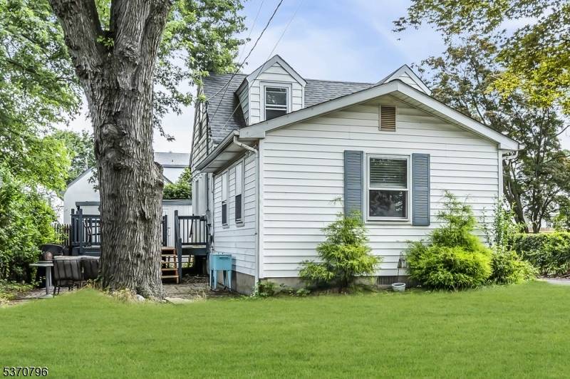 Welcome to this beautifully maintained expanded Cape Cod style home set back on a deep front level lawn.