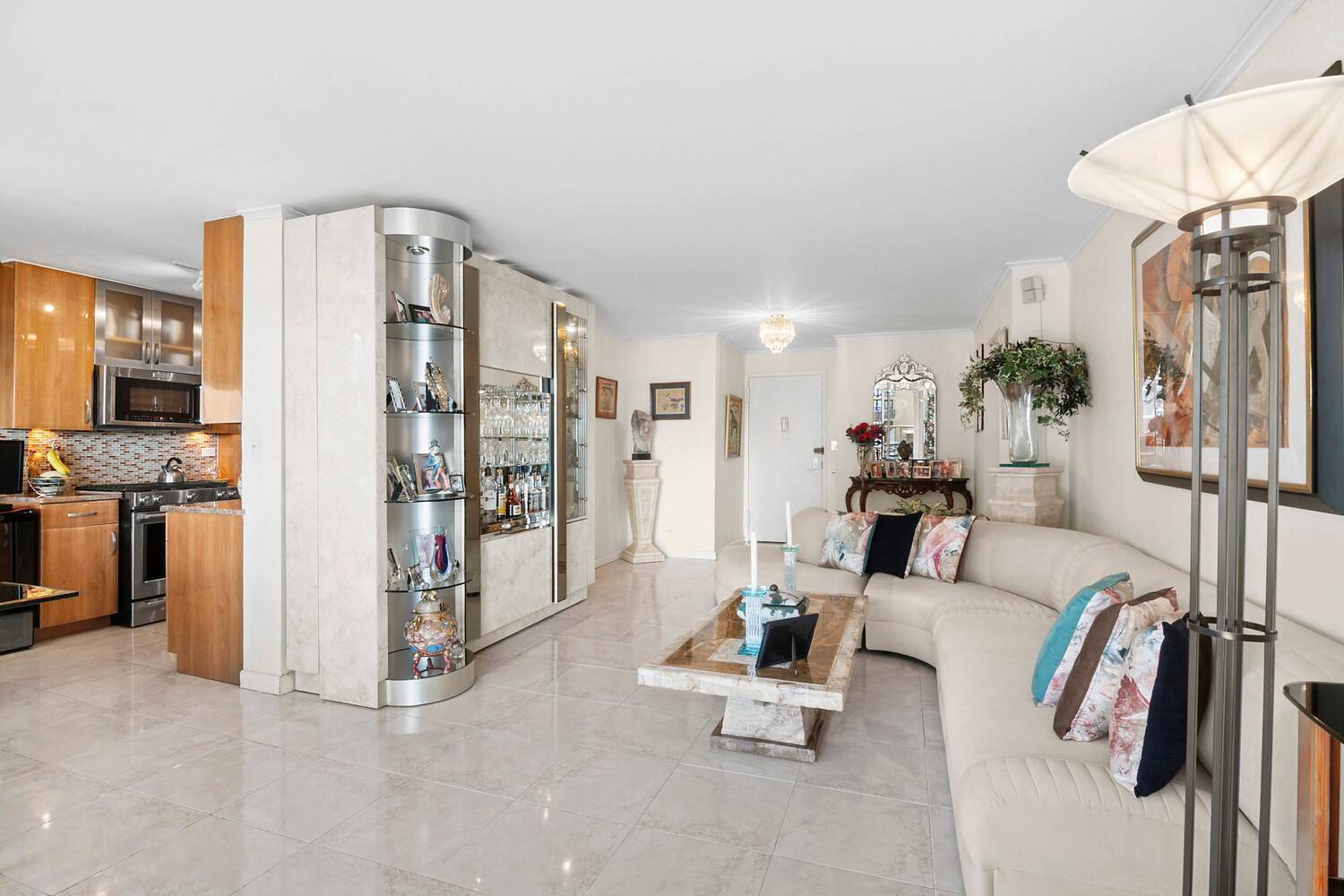 Welcome to this expansive and beautifully renovated, triple mint, 3 bedroom, 2 bathroom coop in the prestigious Americana building at the Towers at Water's Edge.