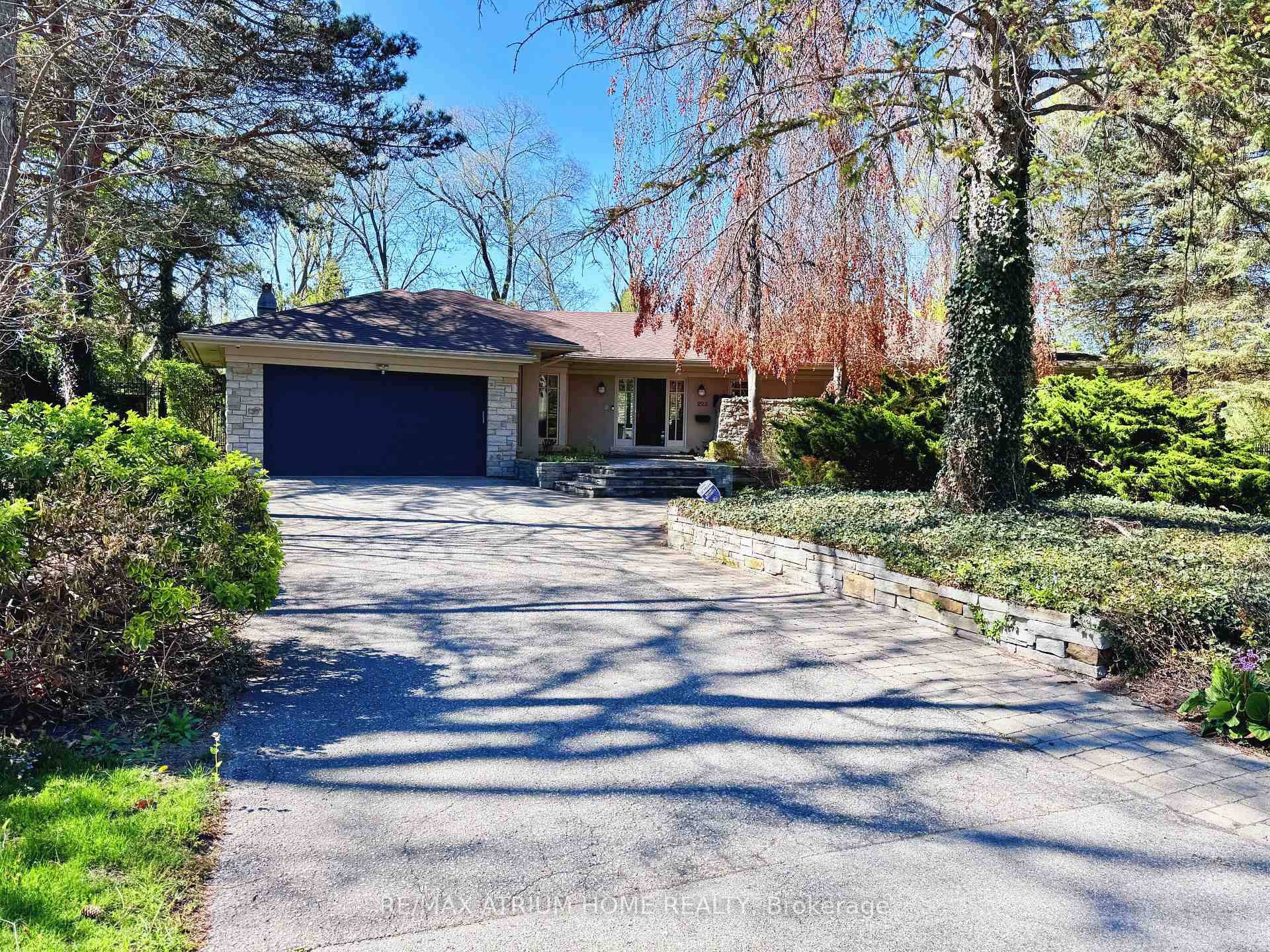 Executive bungalow in prestigious Eastlake offering 5431 sqft of finished space on a mature, naturally elevated lot with excellent drainage.