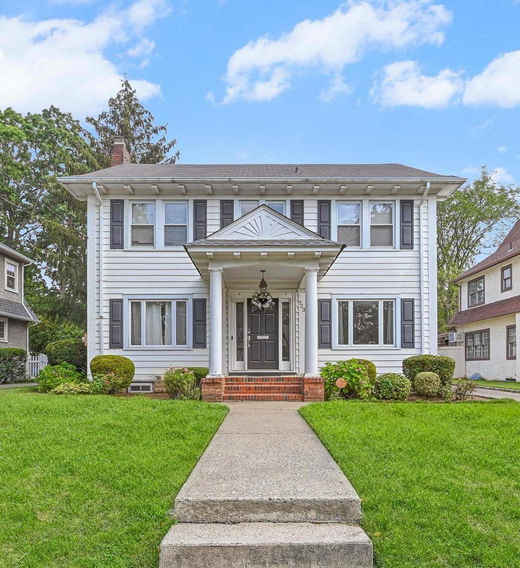 Welcome to this beautifully maintained Colonial, tucked away on a quiet, tree lined street.