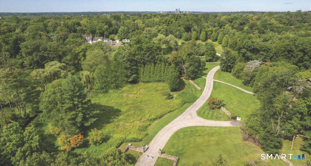Introducing one of New York's most prestigious estates a rare opportunity to own a historic piece of history elegantly nestled atop 11 park like acres in Purchase.