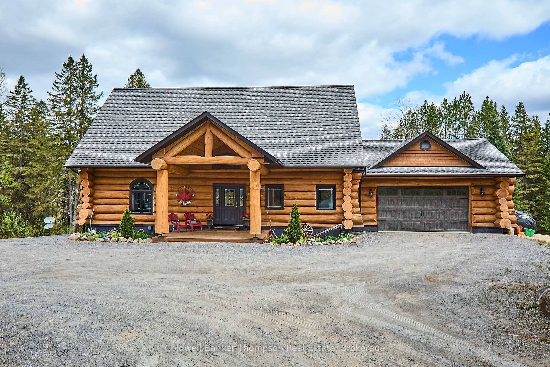 Experience the timeless beauty of this custom log home, masterfully crafted by Little Log Homes for the current owner.