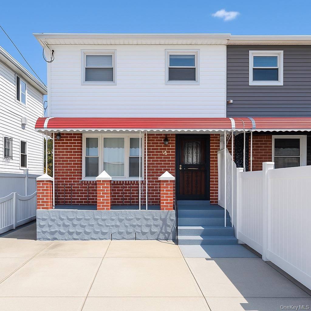 Beautiful Semi Attached Colonial In Jamaica, features a bright living room, dinning area, kitchen and laundry on the first floor.