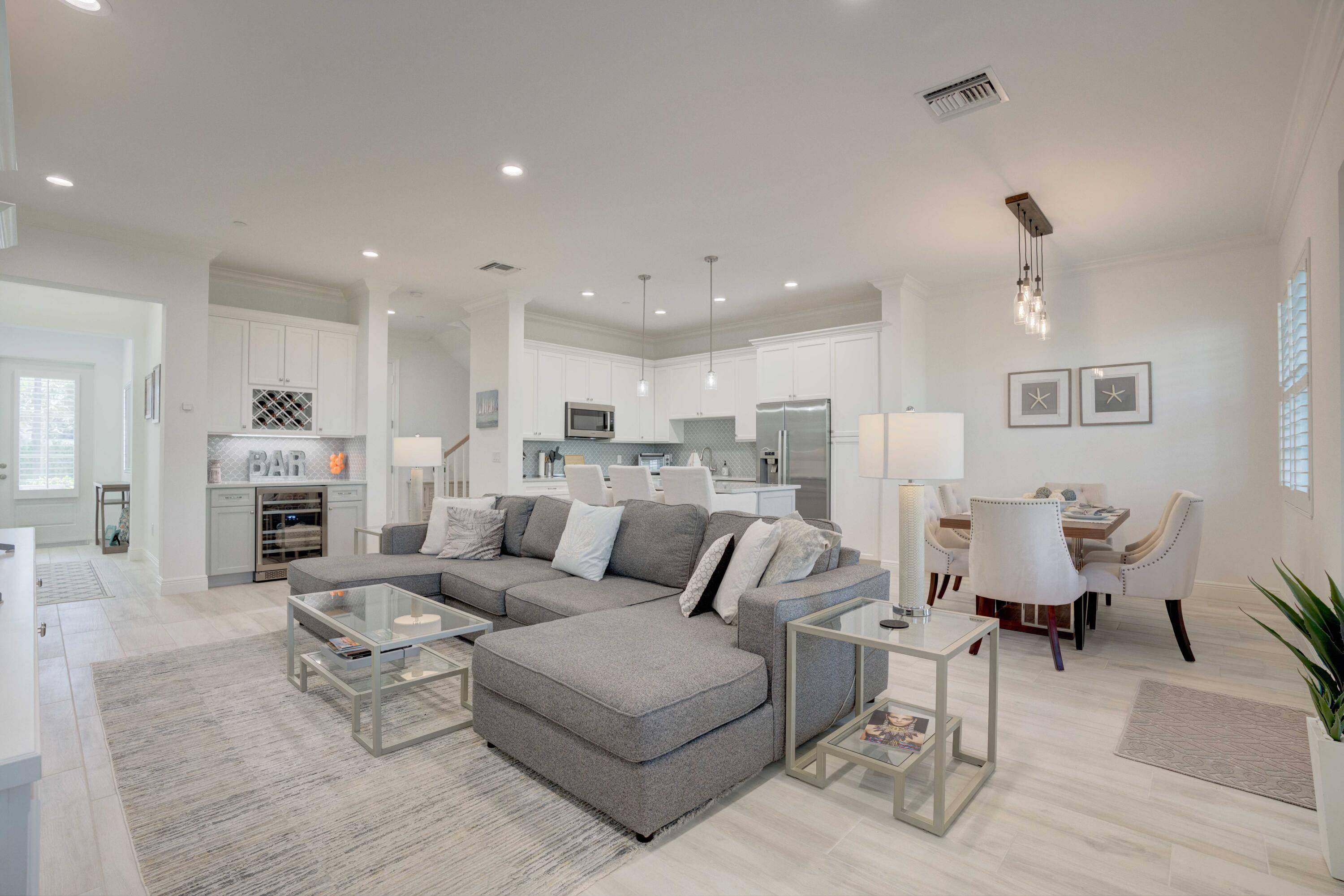 Key West Style 3Bed 2. 5 bath 2 car garage townhome that combines traditional elegance with an open and spacious design.