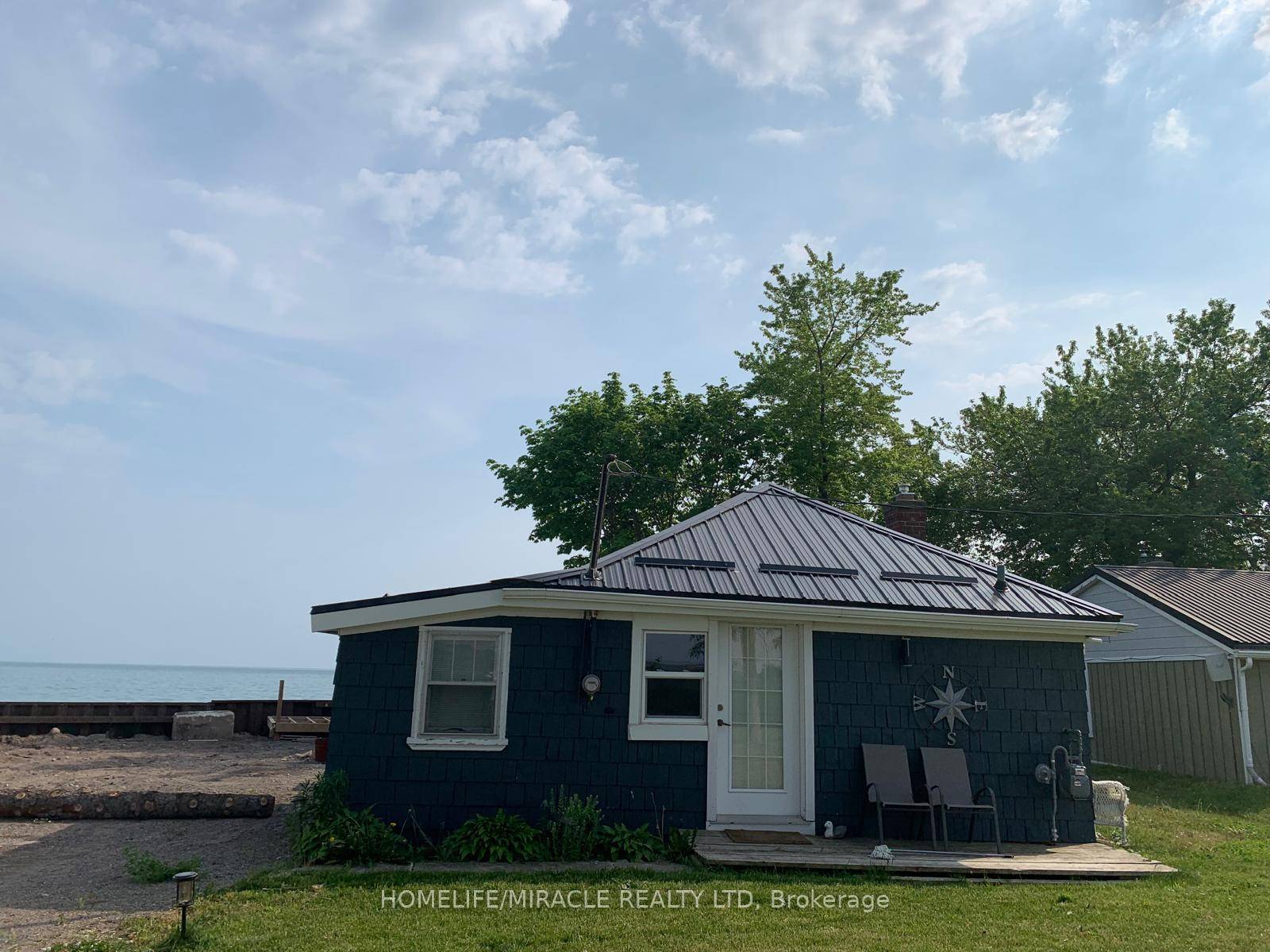 Welcome to 18222 Erie Shore Drive, a rare waterfront property featuring two lots combined into one expansive parcel along the shores of Lake Erie.