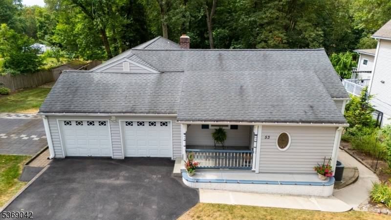 Welcome to this beautifully expanded raised ranch, tucked away on a quiet, dead end street in sought after Midland Park.