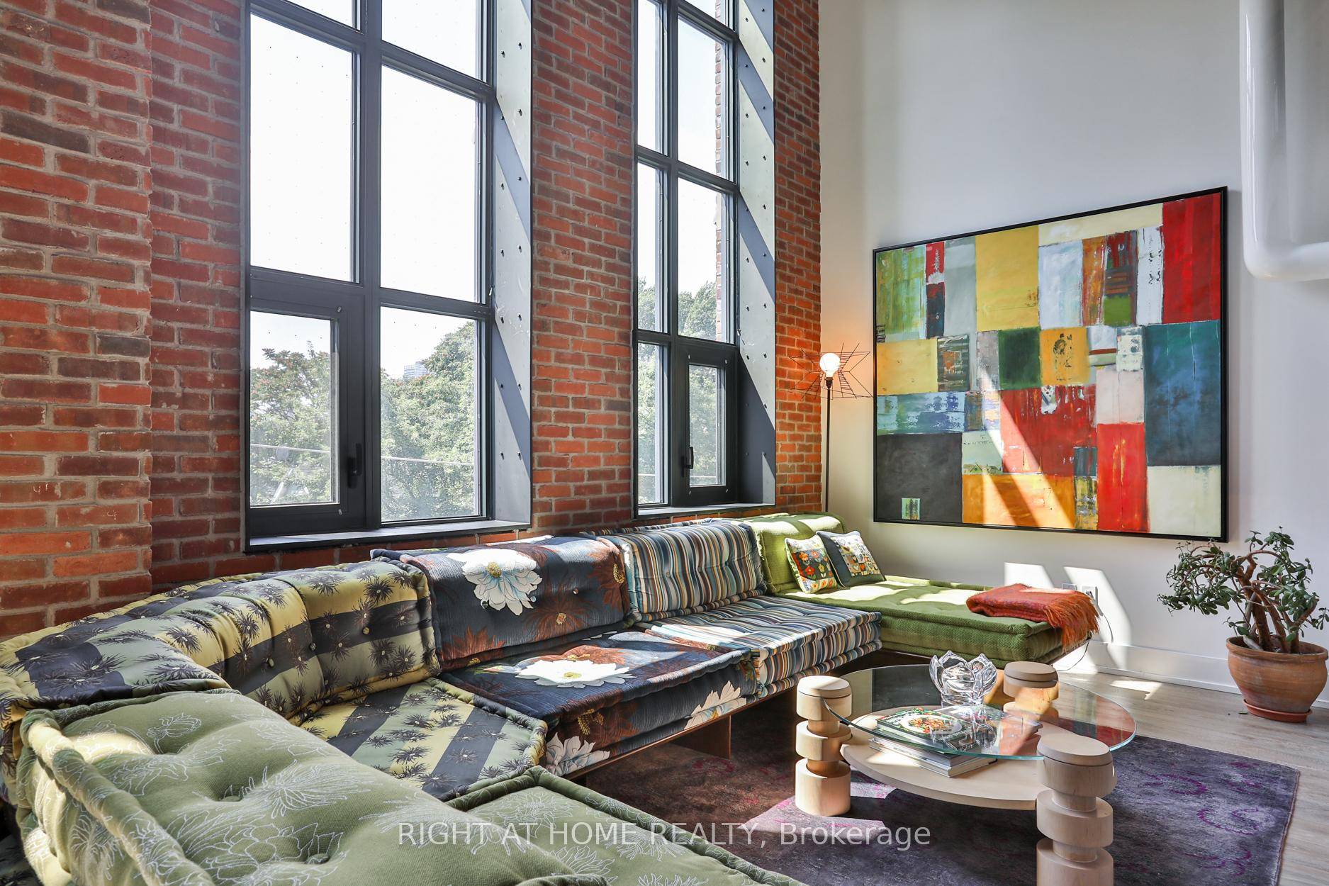 Something truly special at Wonder Condos a sun filled heritage loft with ideal west exposure, dramatic 17 foot ceilings, and original character throughout.