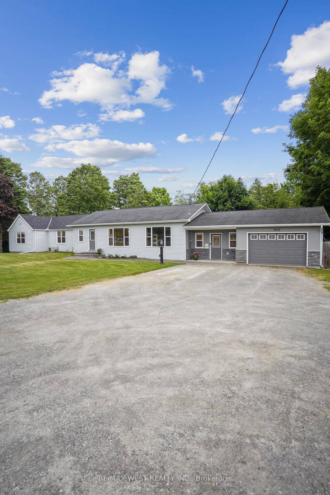 A stunning 2. 4 acre property with beautiful wooded forest and walking paths behind, creating a spectacular backyard oasis.
