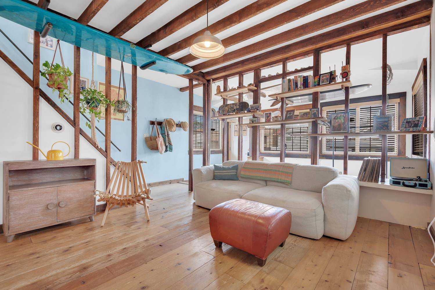 Abundant sunlight beams golden and time seemingly stands still in this charmingly rustic and effortlessly chic beach house in the Rockaways.