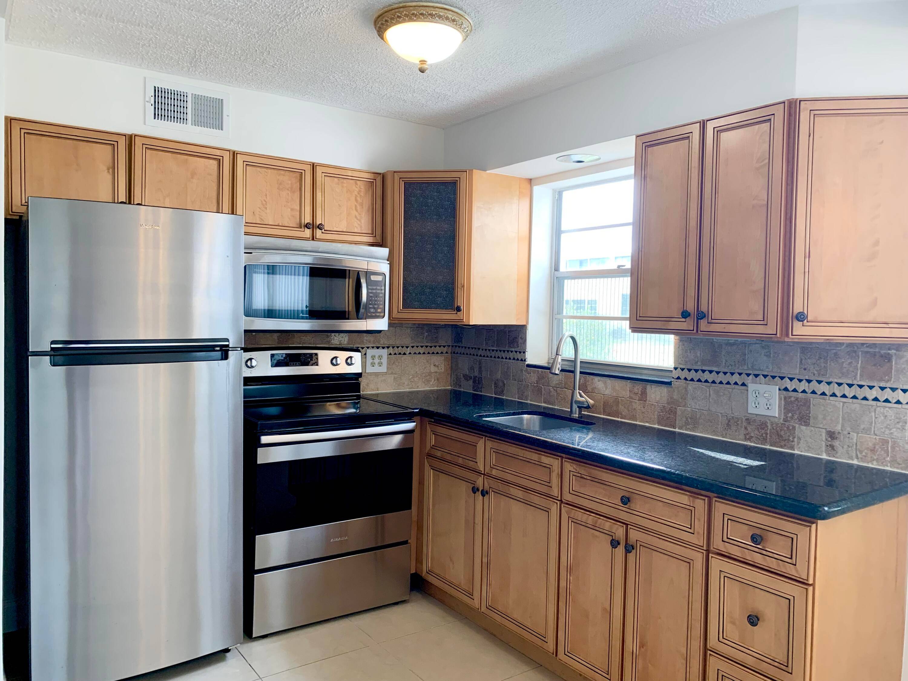 LOCATION LOCATION UPDATED UNIT BONUS 2 FULL BATHS, WALK IN SHOWER.