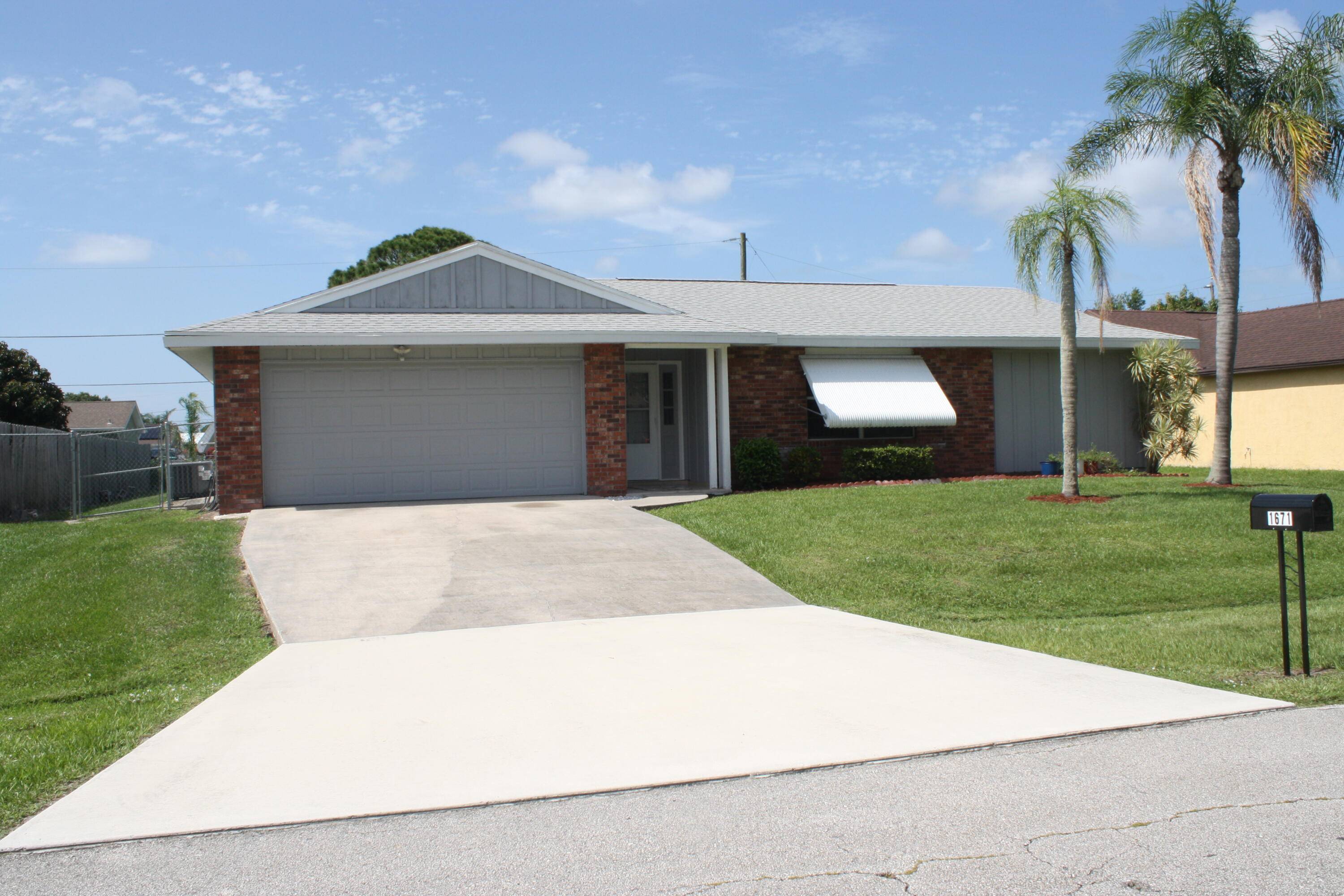 A MUST SEE GEM, Screened Pool with large backyard, Granite Countertops in Kitchen including the island.